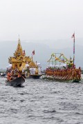 People row long-boats with their legs to pull the Phaung Daw (Royal Boat) during the annual 18-day Phaung Daw Oo festival at Inle Lake